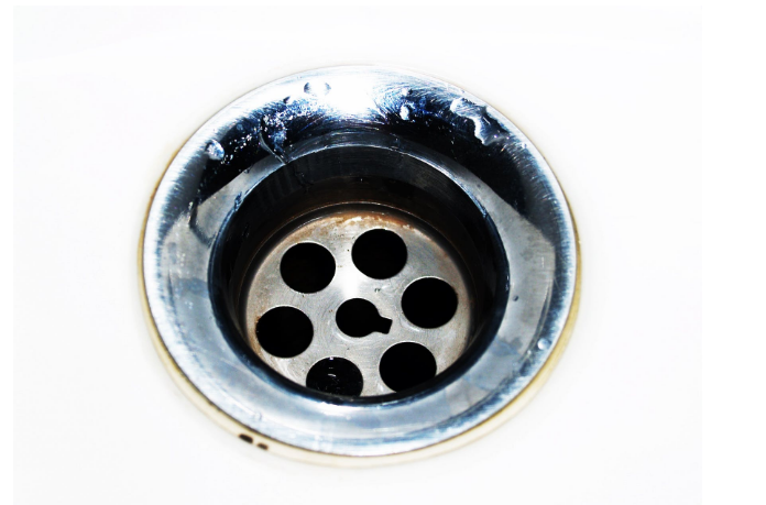 metal drainage with white surrounding