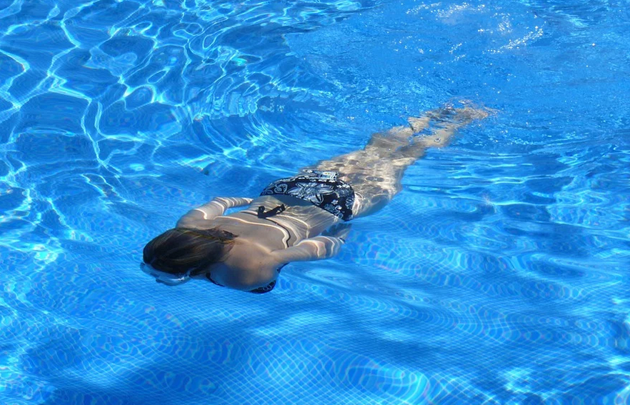 a crystal clear swimming pool